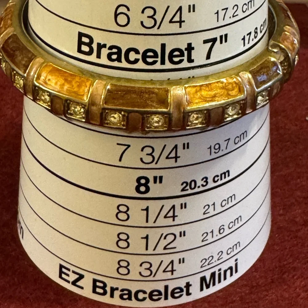 Gold tone with brown and caramel enamel hinged bracelet w/rhinestone accents